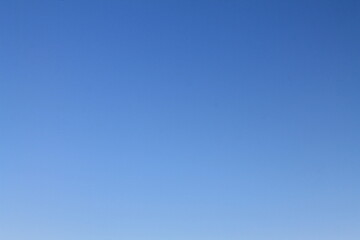 Blue cloudless sky. Background, wallpaper for designers