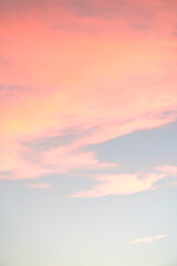Beautiful pink clouds in the blue sky. Background for screen saver, wallpaper, cover. High quality photo