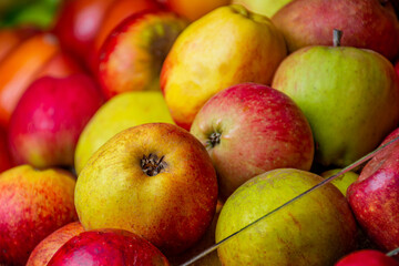 apples in the market. group of sweet apples. apple in the foreground. tropical fruits. market place in latin america. 