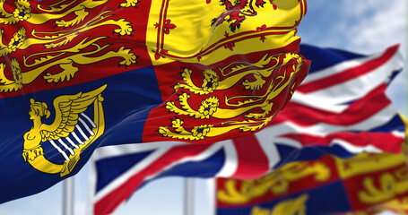 The Royal Standard of the United Kingdom waving the wind along with the UK flag
