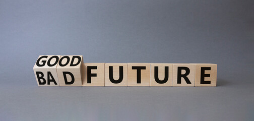 Good and bad Future symbol. Turned wooden cubes with words Bad Future and Good Future. Beautiful grey background. Business concept. Copy space