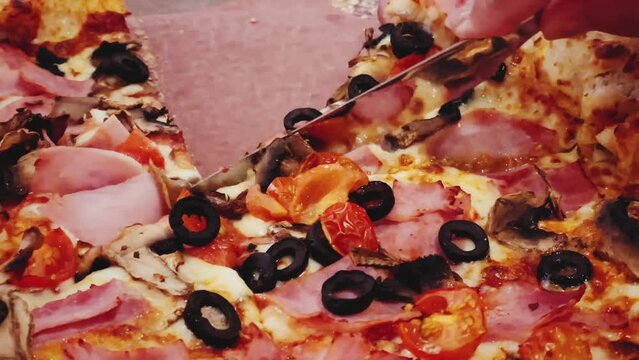 Pizza capriciosa with cheese stuffed crust in pizzeria, food close-up
