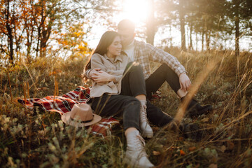 Stylish couple walking and enjoying autumn weather. People, lifestyle, relaxation and vacations concept. Autumn Fashion, style concept.