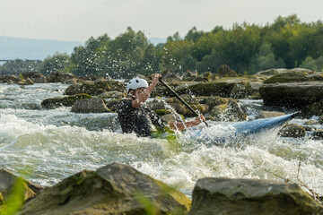 A Kayaker Braving the Treacherous Rapids of a Wild River