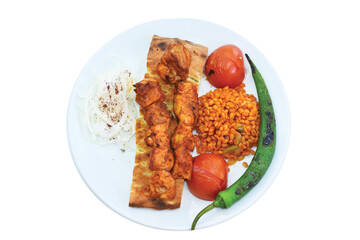top view of grilled chicken skewer with bulgur pilaf, roasted pepper and tomatoes served on plate