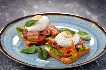 toasts with poached egg and bacon