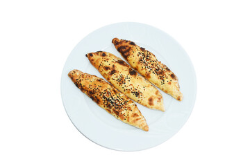 top view of traditional sesame mince pies served on white plate