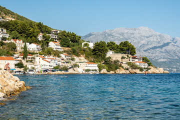 Houses built on the steep slope of Dinara mountain at the village of Mimice, Croatia
