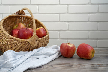 a basket of freshly picked apples on the kitchen table