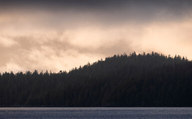 Tofino, Vancouver Island, British Columbia, Canada. View of Canadian Mountain Landscape on the West Coast of Pacific Ocean. Nature Background. Sunset Sky.