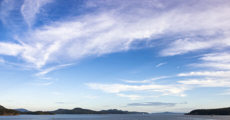 Obraz premium Cloudy Cloudscape during sunny summer Day on the West Coast of Pacific Ocean. British Columbia, Canada. Sunset Sky