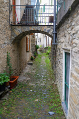Fototapeta na wymiar view of the alleyways and stone houses of realdo (ligurian region, imperia province, northern italy). small typical village, is one of the last italian sites before the italy-french borders.