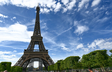 Paris, France, June 2022. In the large gardens of the Champ de Mars people relax in the greenery...