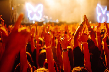 Сrowd with raised hands at music festival.  Youth, party, vacation concept.