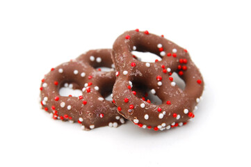 Several milk chocolate covered pretzels 