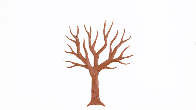 Bare tree without leaves molded from plasticine. White background.