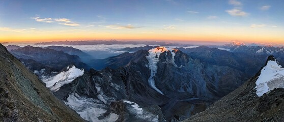 Sunrise on the summit climb of the Grand Combin. View of the Mont Vélan mountain. mountaineering in the valais mountains, switzerland. Wonderful mountain panorama with a view of the Mont Blanc massif