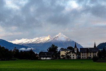 The Swiss Alps overlooking the mountain town of Interlaken Switzerland next to the Lauterbrunnen valley..	