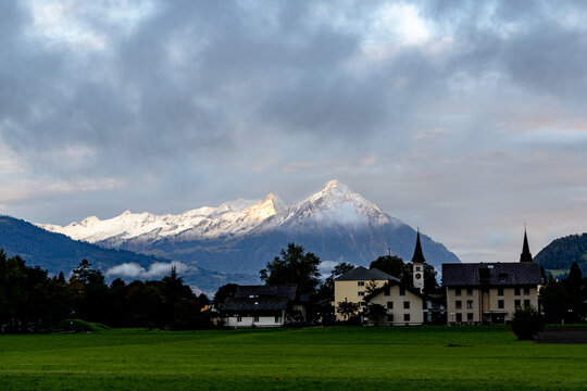 The Swiss Alps overlooking the mountain town of Interlaken Switzerland next to the Lauterbrunnen valley..	