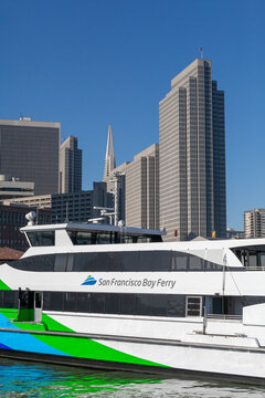 San Francisco Ferry departing with Embarcadero Towers and Transamerica Building in the background