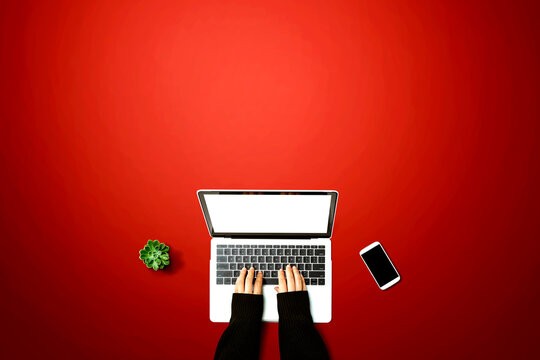 Person using a laptop computer from above