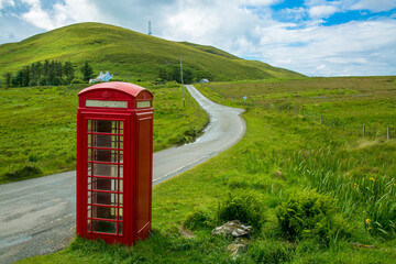 Red phonebooth in the hills
