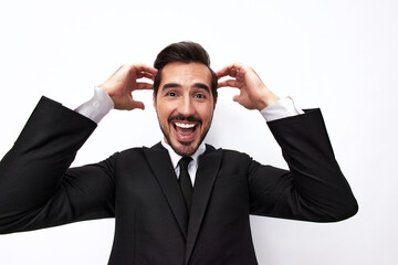 Portrait of a man in an expensive business suit close-up wide-angle lens pulls his hands into the camera with open mouth surprise happiness smile with teeth on a white background, copy space