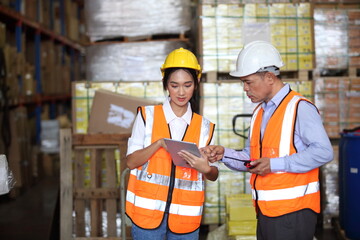  Portrait of worker in warehouse, they happy and working at The Warehouse. Storehouse area, Shipment.  warehouse worker unloading pallet goods in warehouse