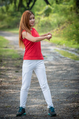 Young Asian healthy woman exercise in the park.