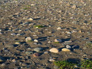 Rock on the sand.   Rubble on the ground. Stones scattered on the ground.