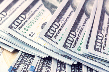 Dollar banknotes as background, closeup view. Money exchange
