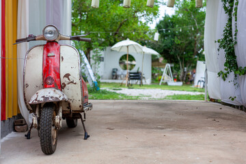 An ancient motorcycle that was displayed at the entrance of the cafe.