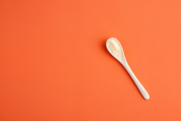 Powdered milk with nutrients in the spoon