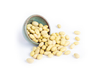 Peruvian Canary Beans Isolated on White Background Spilling from Green Pottery Bowl