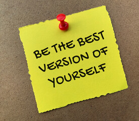 Be the best version of yourself text on yellow notepad with wooden background. Motivational concept