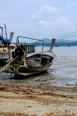 Fototapeta na wymiar Fishing boats moored in a local fishing jetty on Yao Yai Island, Phang Nga, Thailand.