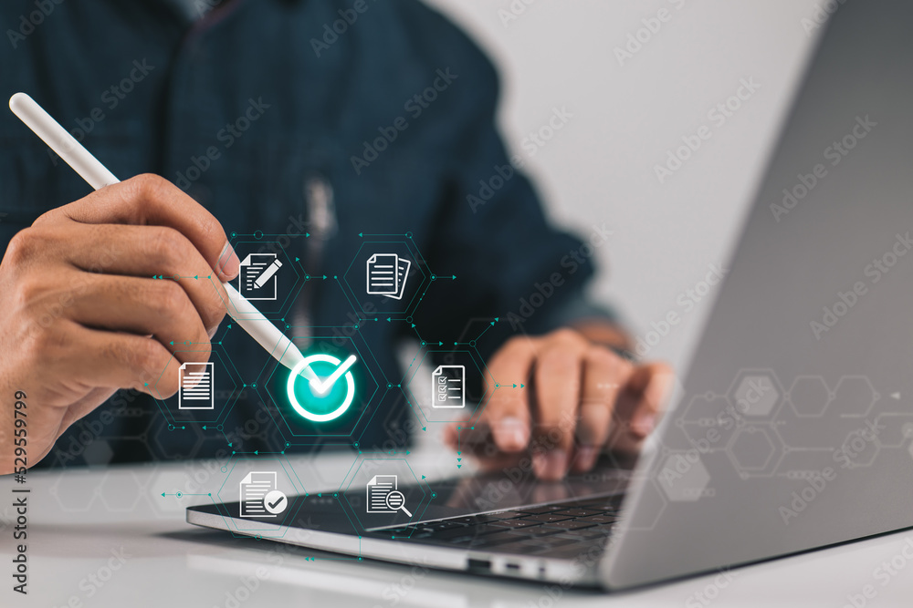Aufkleber businessman giving his approval to an electronic document while using a stylus pen and a digital tab
