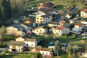 Aerial view of residential houses in green suburban rural area