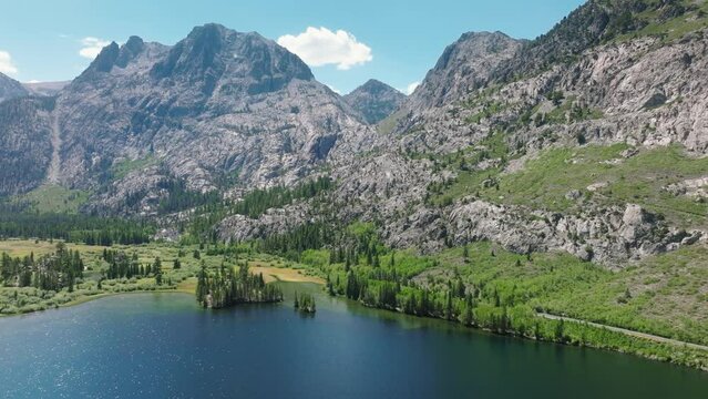 June Mountain ski area with cinematic blue Silver lake with scenic rocky mountain peaks. Beautiful peaceful place for weekend leisure activity California. June lake loop in Mammoth ski recreation area