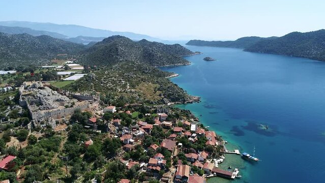 Kekova, also called Caravola, is a Turkish island in Antalya province. Aerial view of Simena castle and magnificent nature on the island..