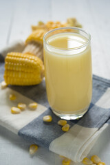 Yellow Sweet corn drink on wood  background , Yellow Corn juice, sweet corn milk, healthy organic food, bio nutrition