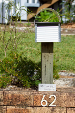 Mailbox for house number 62, plus no junk mail sign.