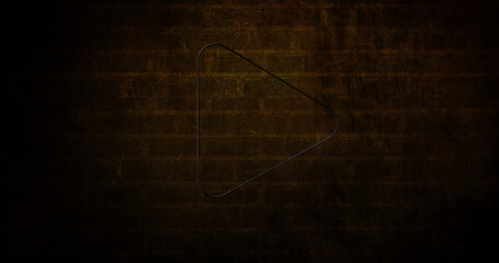 Image of glowing neon arrow icon on brick wall