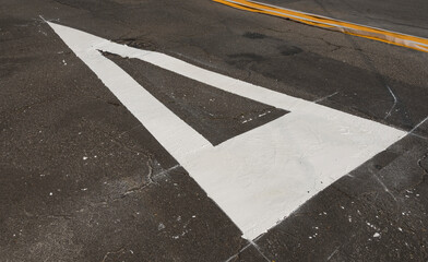 Traffic signage. Asphalt painting. Preference sign at the intersection.