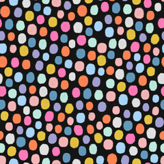 Colorful dots on black background. Polka dots design.