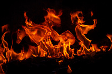 Fire flames on black background. Fire burn flame isolated, abstract texture. Flaming effect with...