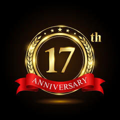 17th golden anniversary logo, with shiny ring and red ribbon, Laurel wrath isolated on black background, vector design