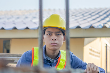 Asian Engineer construction are worker employee working by safety control helmet on site building