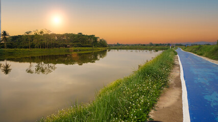 Evening sunset, rows with roads for exercise and a reservoir