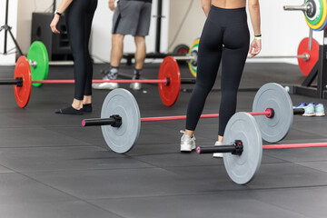 Fototapeta na wymiar Fitness Workout at Gym: Girls doing Exercises in Class with Barbells
